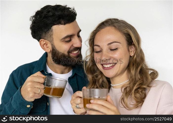 cute couple making tea home together