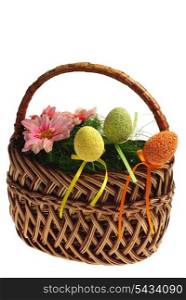 Cute easter basket with eggs and flowers. Isolated on white background