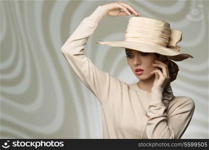 cute elegant vogue girl wearing coordinated beige hat and dress, in fashion pose with romantic expression