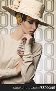 cute fashion shot of cool lady in sensual pose with coordinated beige hat and dress, elegant style, pretty make-up