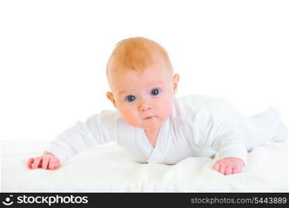 Cute four month old baby girl laying on abdomen on diaper &#xA;