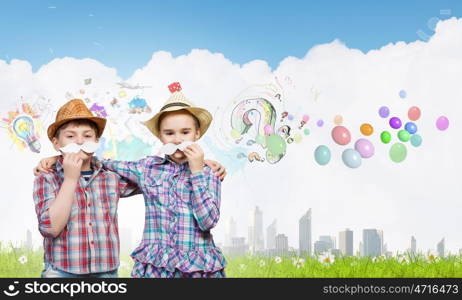 Cute girl and boy wearing shirt hat and mustache. Kids having fun