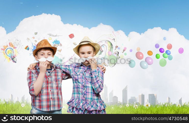 Cute girl and boy wearing shirt hat and mustache. Kids having fun