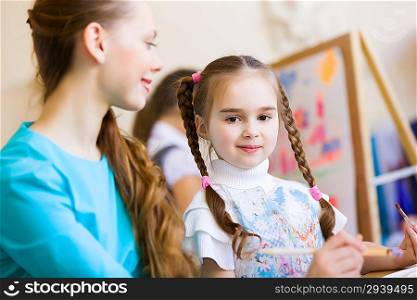 Cute girl and teacher