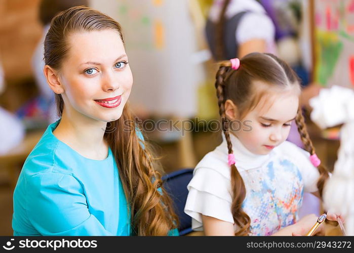 Cute girl and teacher