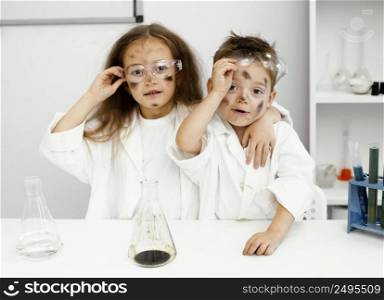 cute girl boy scientists laboratory with test tubes failed experiment
