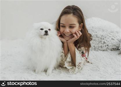 cute girl dog sitting bed