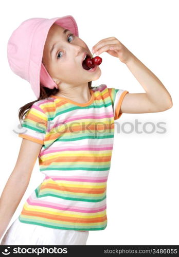 Cute girl eating fresh cherries isolated on white