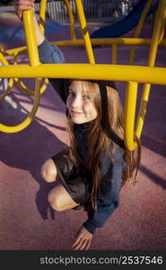 cute girl having fun playground outside