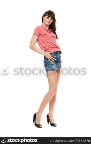 Cute girl in jeans mini skirt. Isolated on white