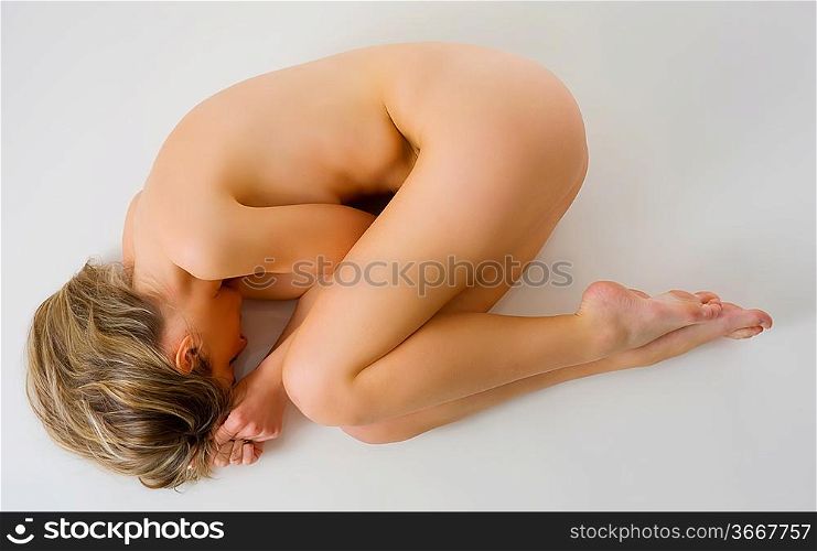 cute girl laying down in beauty pose with naked body
