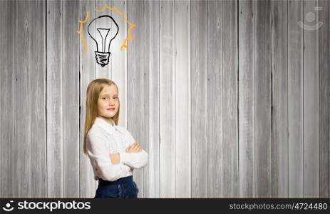 Cute girl of school age. Pretty schoolgirl and light bulb. Idea concept