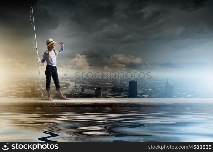 Cute girl of school age with fishing rod