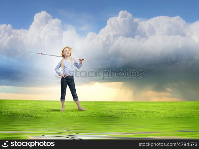 Cute girl of school age with fishing rod