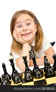 Cute girl playing chess on white