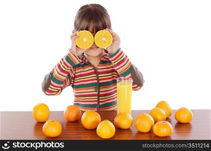 Cute girl playing with oranges and juice