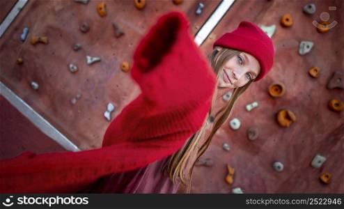 cute girl posing climbing wall