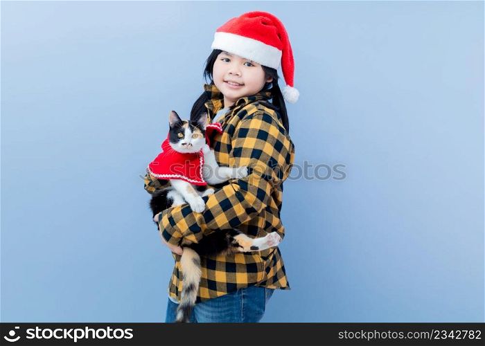 Cute girl taking pictures with her tricolor cat.