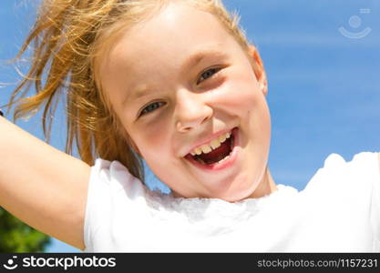 Cute girl with blond long hair and blue eyes