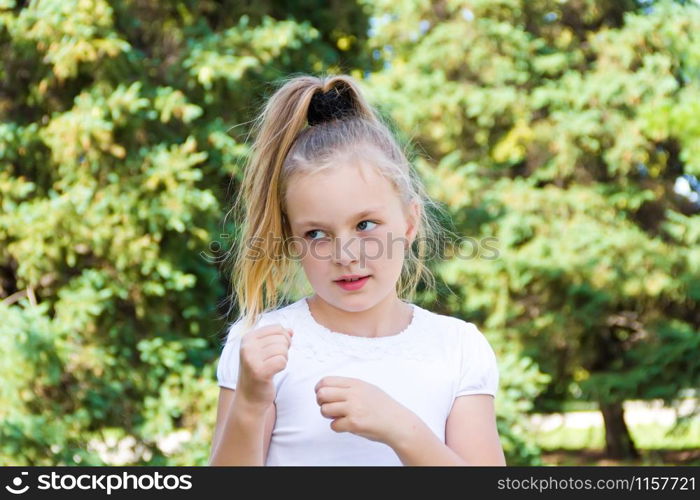 Cute girl with blond long hair and blue eyes