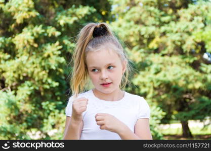 Cute girl with blond long hair and blue eyes