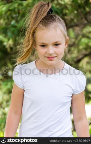 Cute girl with blond long hair and blue eyes