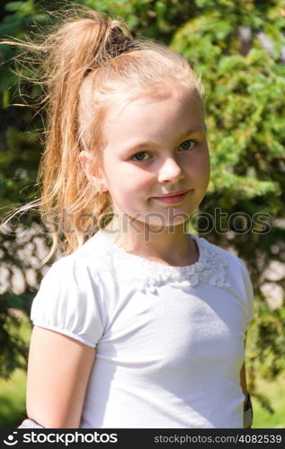 Cute girl with blond long hair and blue eyes