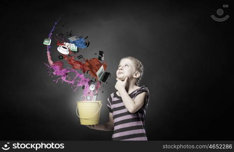 Cute girl with bucket and colorful springs coming out