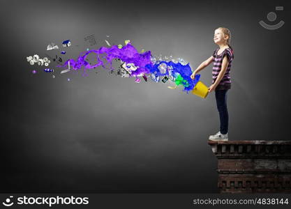 Cute girl with bucket and colorful springs coming out