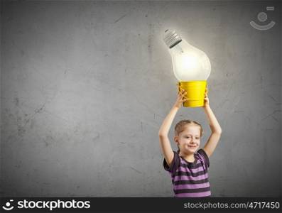 Cute girl with bucket and light bulb in it
