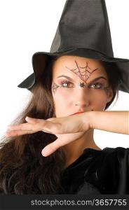 cute girl with witch hat and a spider web painted on face
