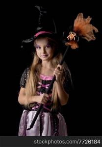 Cute halloween witch girl in fantasy costume, positive character, isolated on black background. Cute halloween witch girl