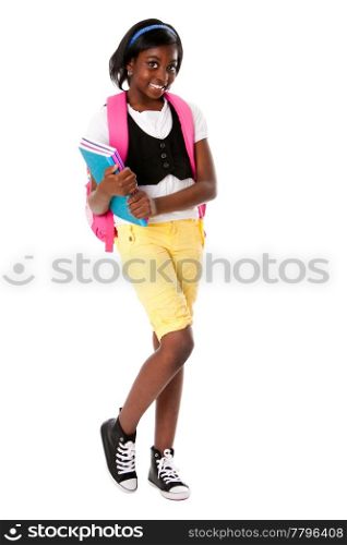 Cute happy child teenager student with colorful notebooks and backpack standing, isolated.