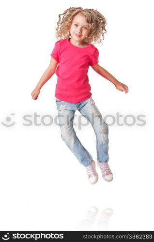 Cute happy smiling jumping of joy girl with heels together in pink shirt and jeans, isolated.