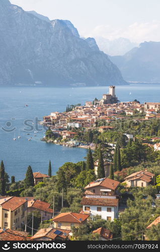 Cute idyllic Italian village and lake captured from above. Malcesine at lago di Garda.