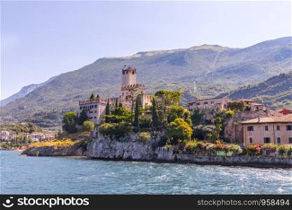 Cute idyllic Italian village and lake captured from the water. Malcesine at lago di Garda.