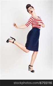 cute jumping woman in t-shirt and skirt