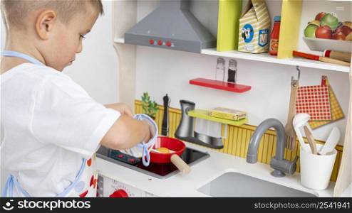 cute kid playing with cooking game 2
