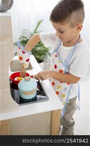 cute kid playing with cooking game