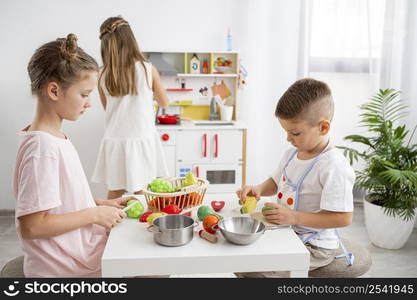 cute kids playing with cooking game 2