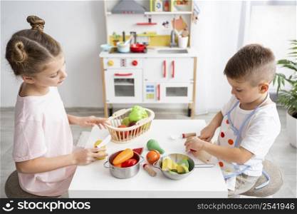 cute kids playing with cooking game