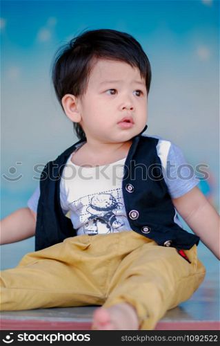 Cute little Asian boy Happy smilling in the park outdoors , Happy kids
