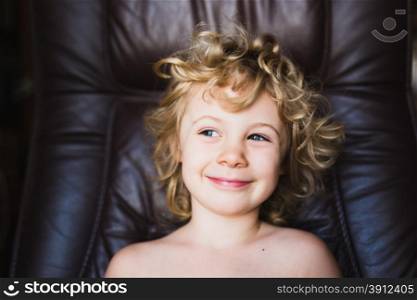 Cute little blonde girl smiling