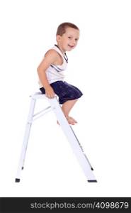 Cute little boy climbing on a stepladder