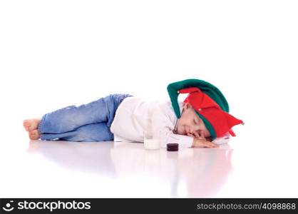 Cute little boy with a christmas hat lying on the floor