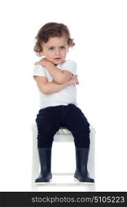 Cute little child with boots isolated on a white background