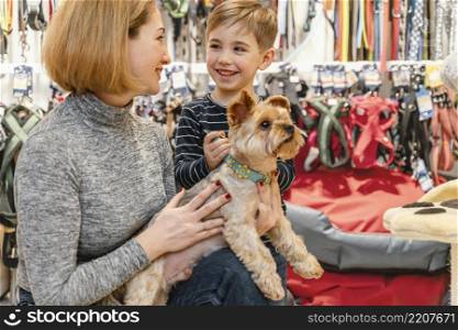 cute little dog with owners pet shop