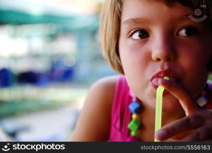 Cute little gilr enjoying cold drink