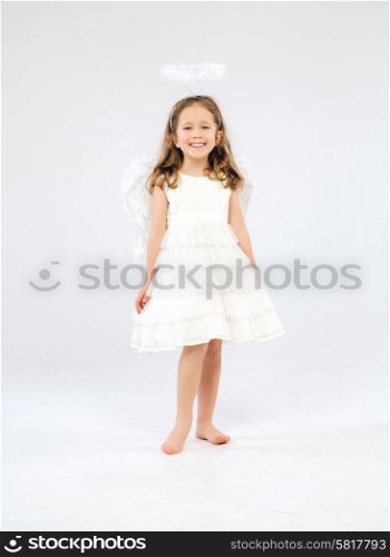 Cute little girl as an pure white angel