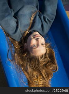 cute little girl having fun slide